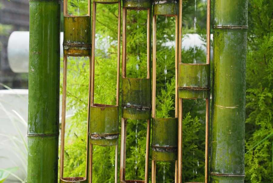 Seven bamboo poles cut to show a follow centre with water running through